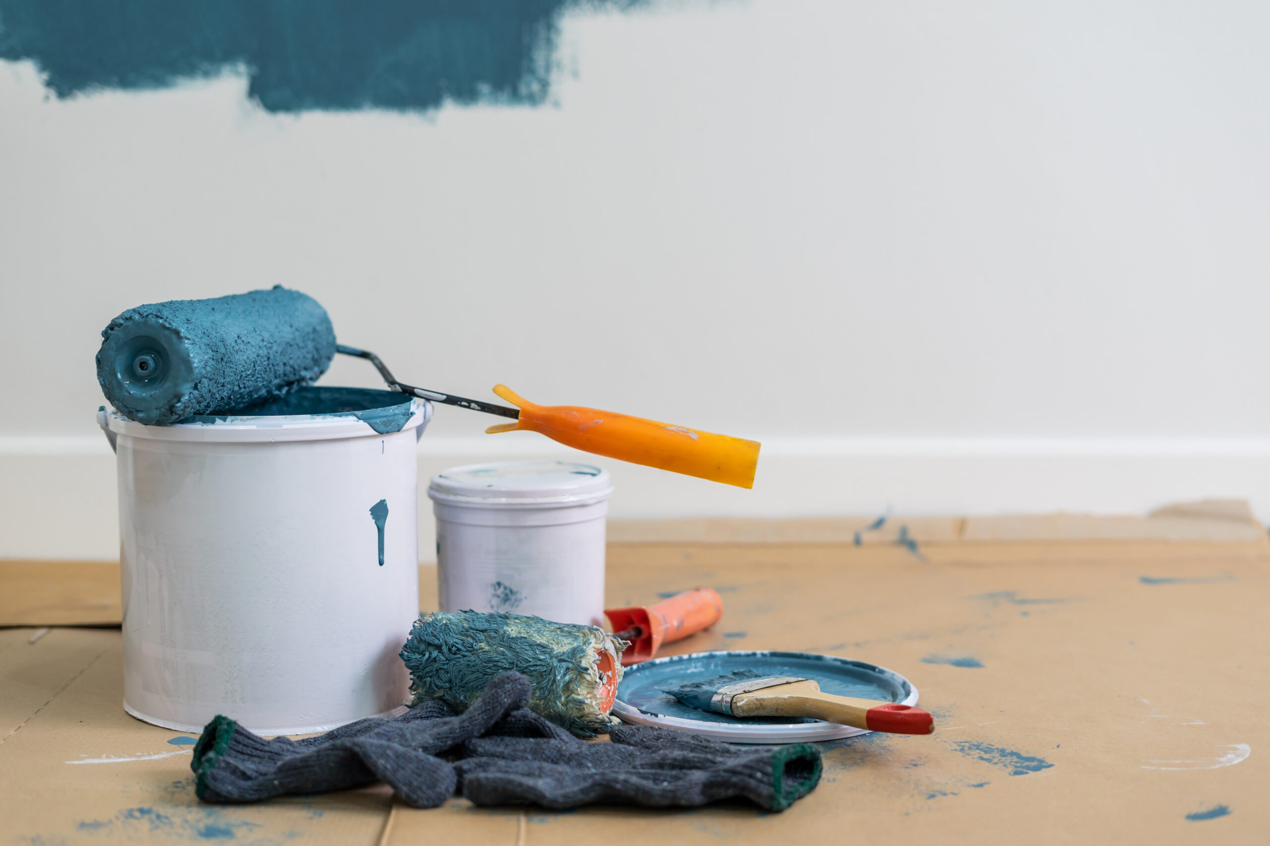 Paint bucket with roller, glove and brush